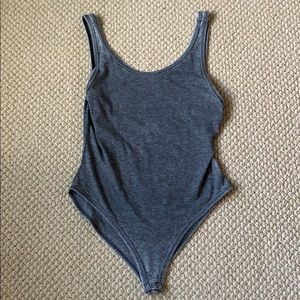 Grey T-shirt body suit with fun side cuts